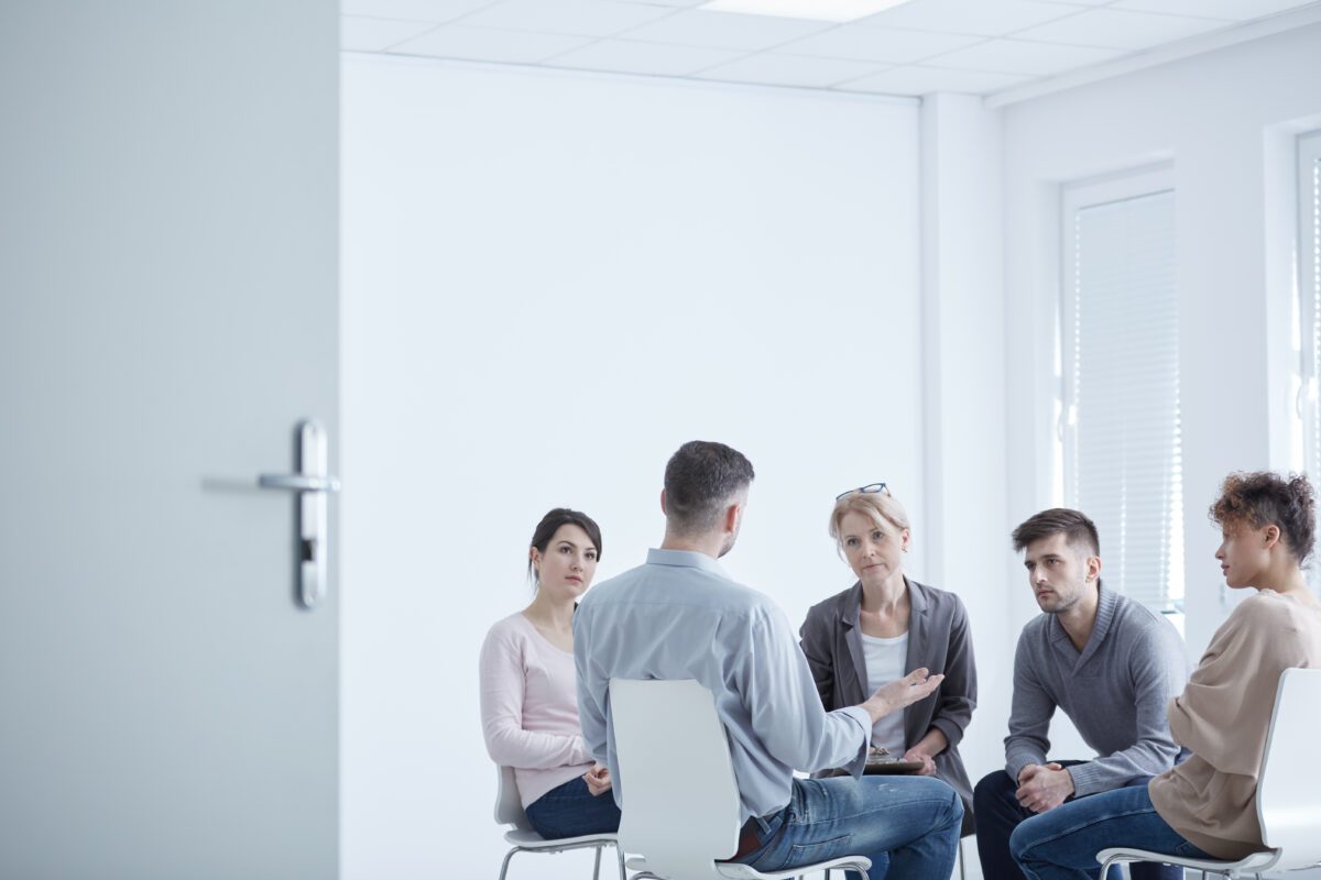 People participating in group therapy for PTSD