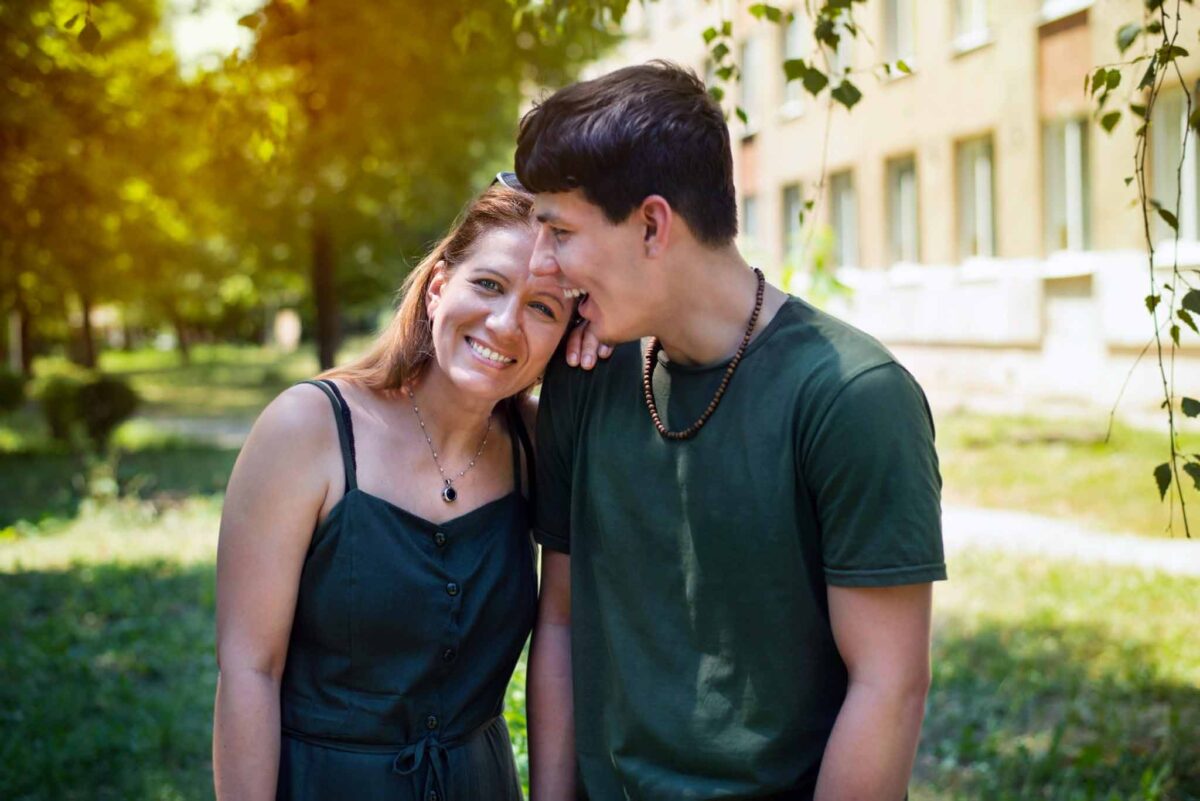 mother and son embracing and happy to start a healing journey in addiction recovery