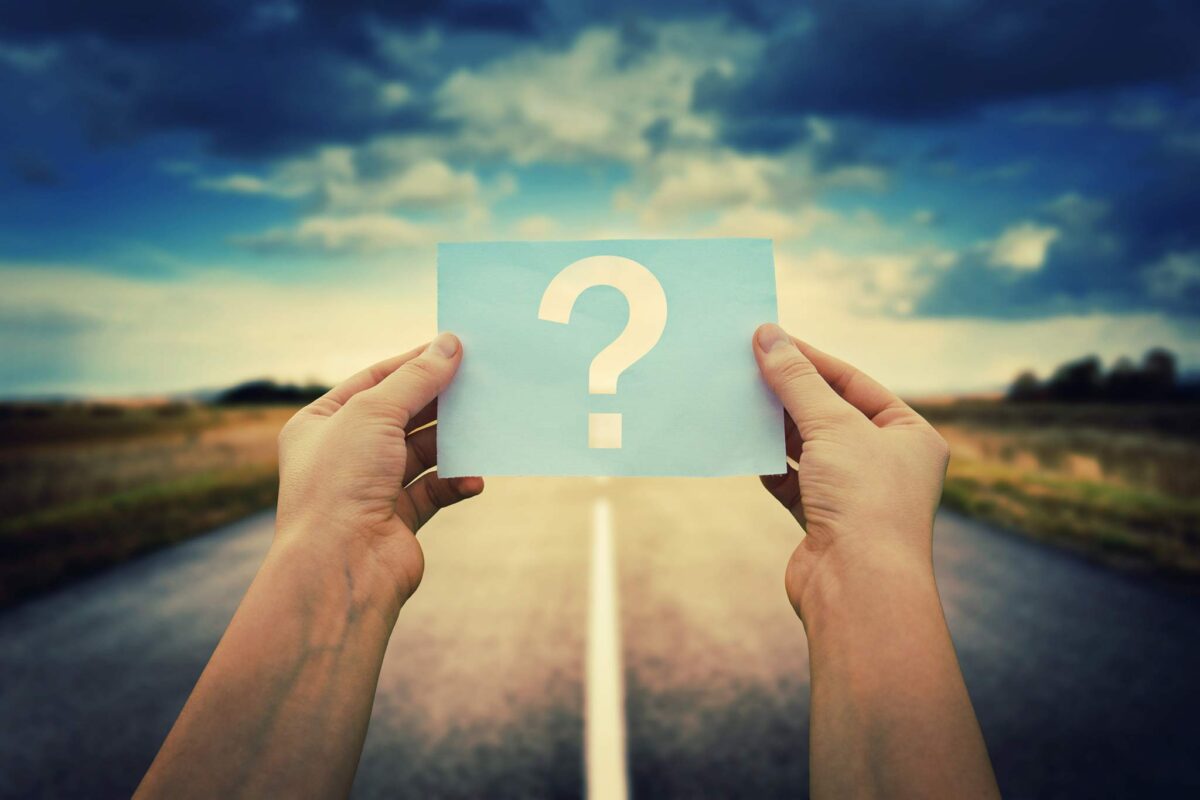 young man holding out a question mark on the road to detox in los angeles