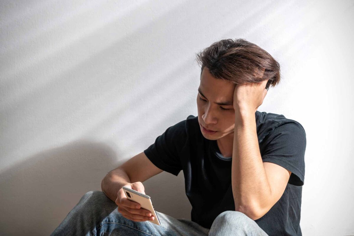 young man struggling with mental and emotional symptoms of addiction