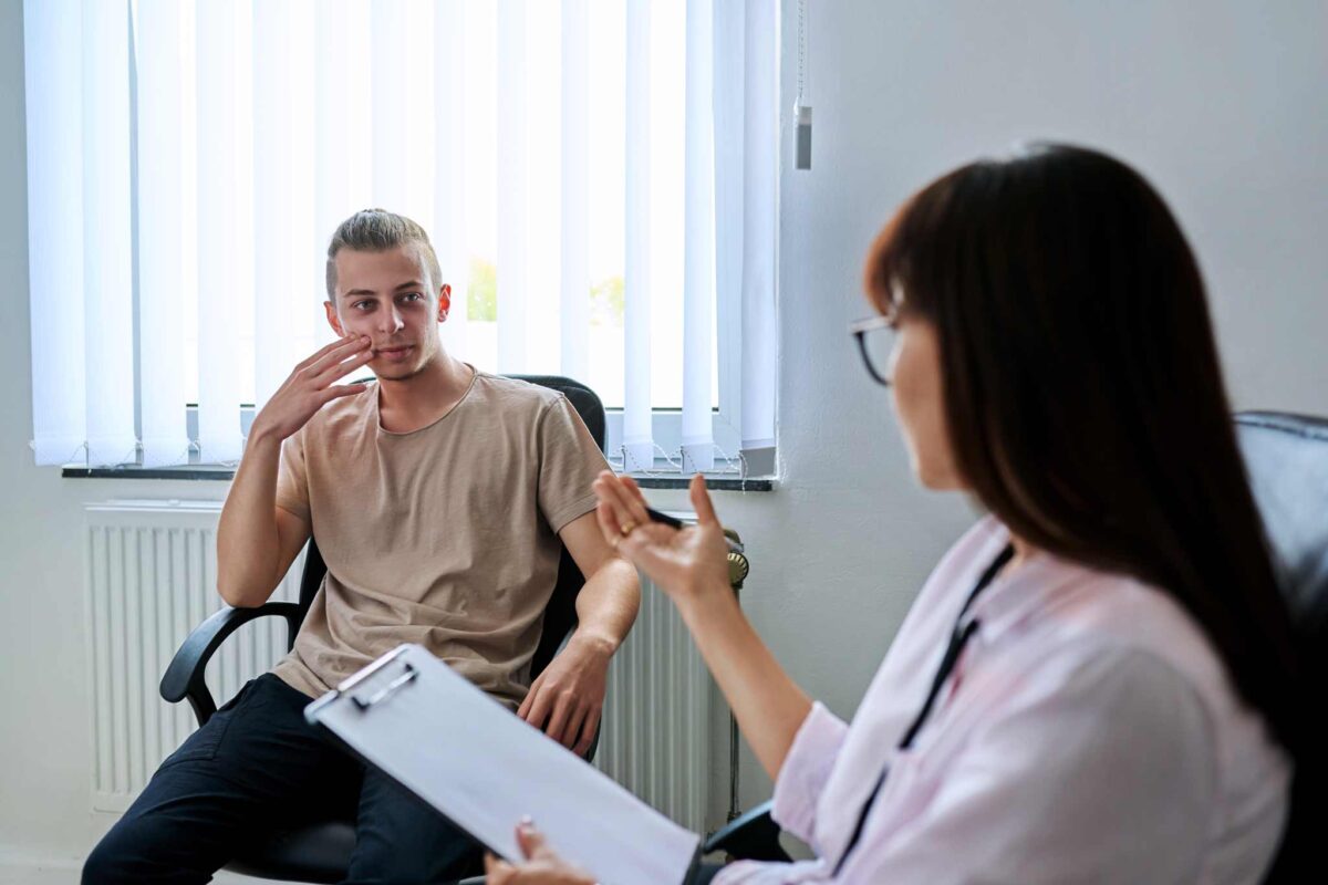 young man meeting with a psychiatrist to discuss support for benzo addiction